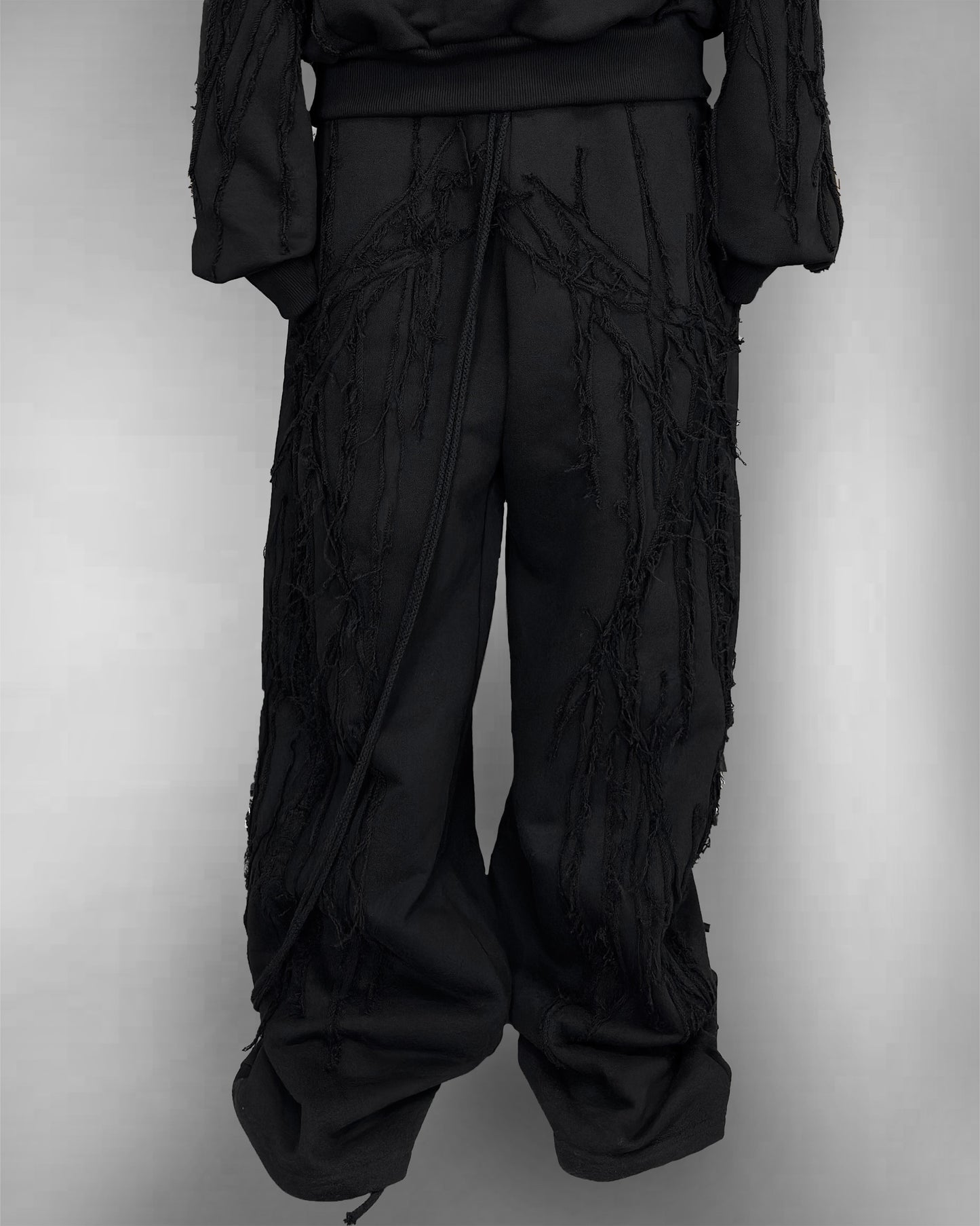 BLACK SCRAPS SWEATPANTS