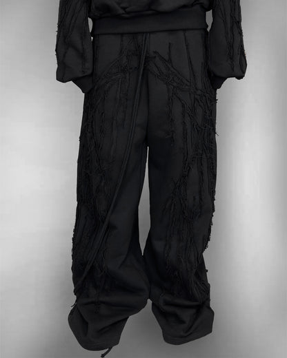 BLACK SCRAPS SWEATPANTS